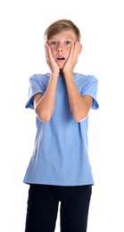 Portrait of young boy standing against white background