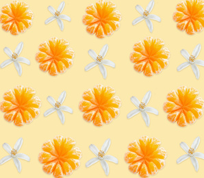 Image of Pattern of peeled tangerines and flowers on pale light orange background
