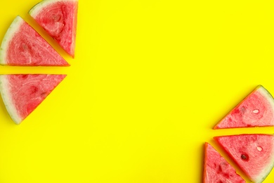 Photo of Slices of ripe watermelon on yellow background, flat lay. Space for text