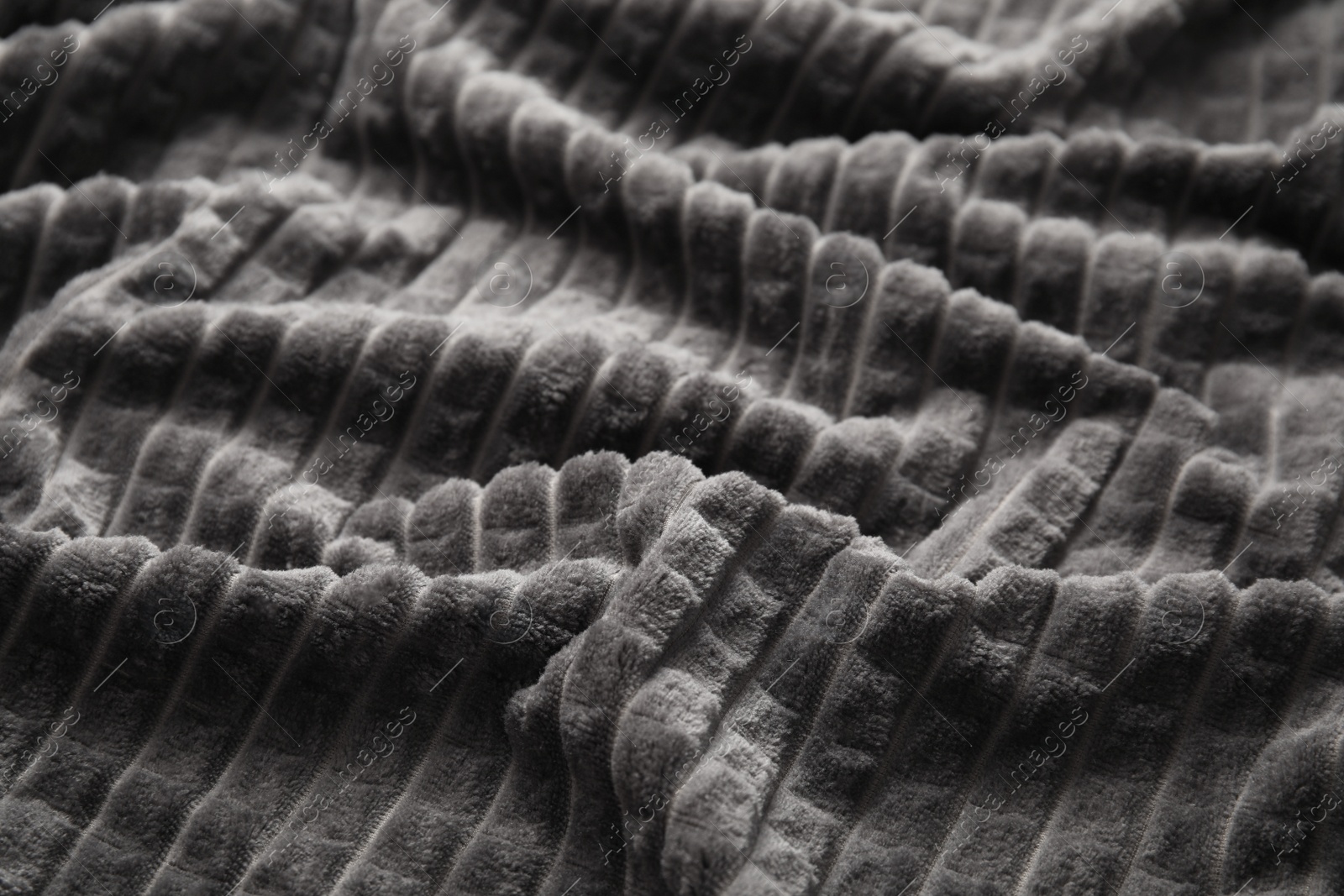 Photo of Soft warm grey plaid as background, closeup