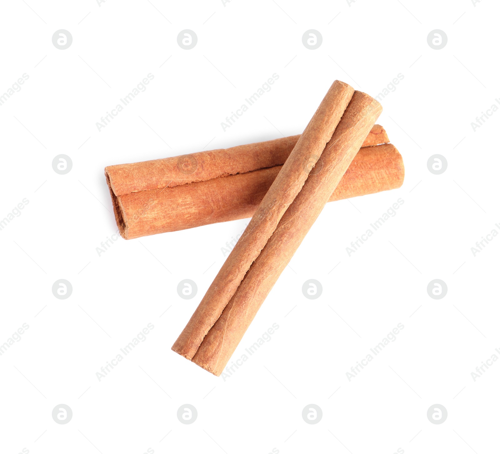 Photo of Two aromatic cinnamon sticks isolated on white, above view