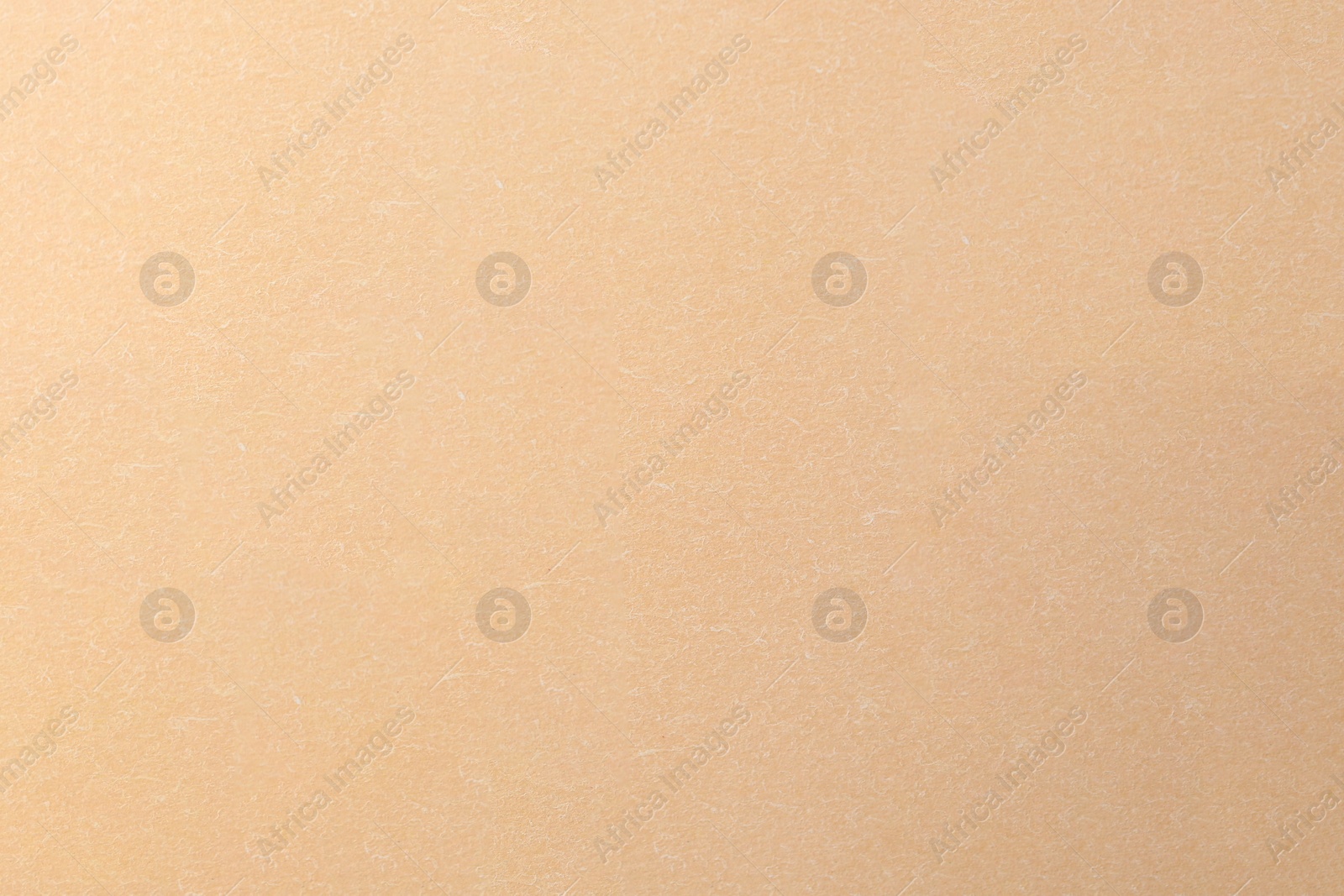 Photo of Texture of beige paper sheet as background, top view