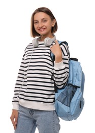 Young student with backpack and headphones on white background