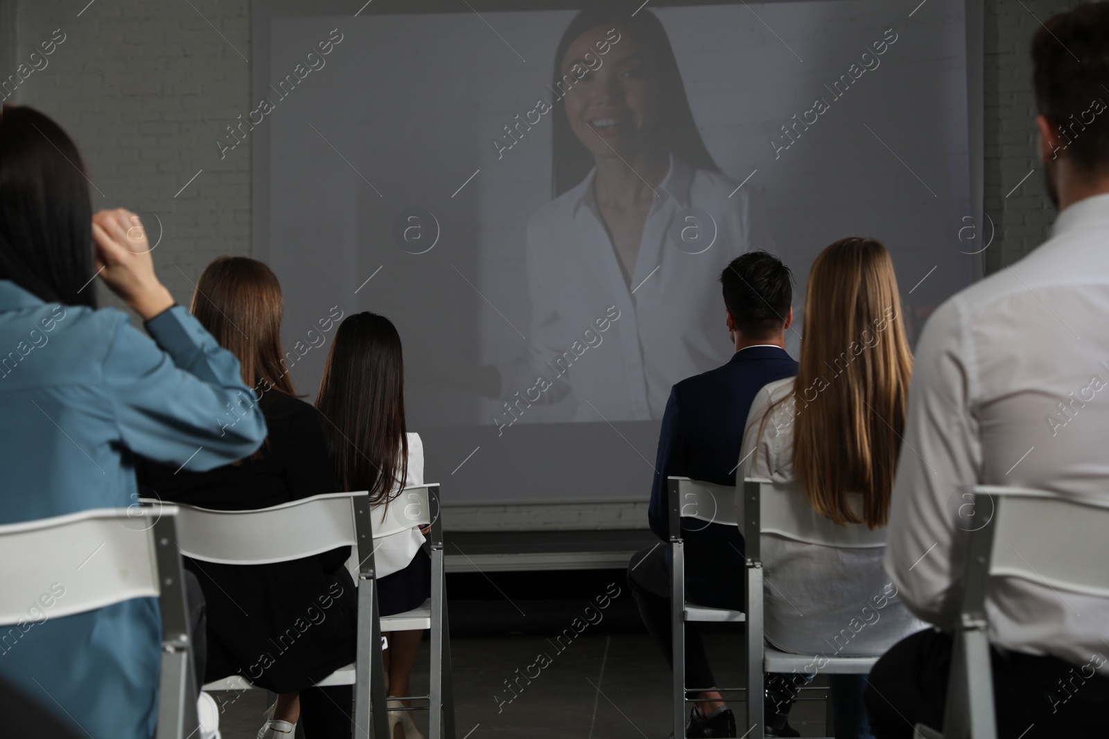 Photo of Video conference with female business trainer in office