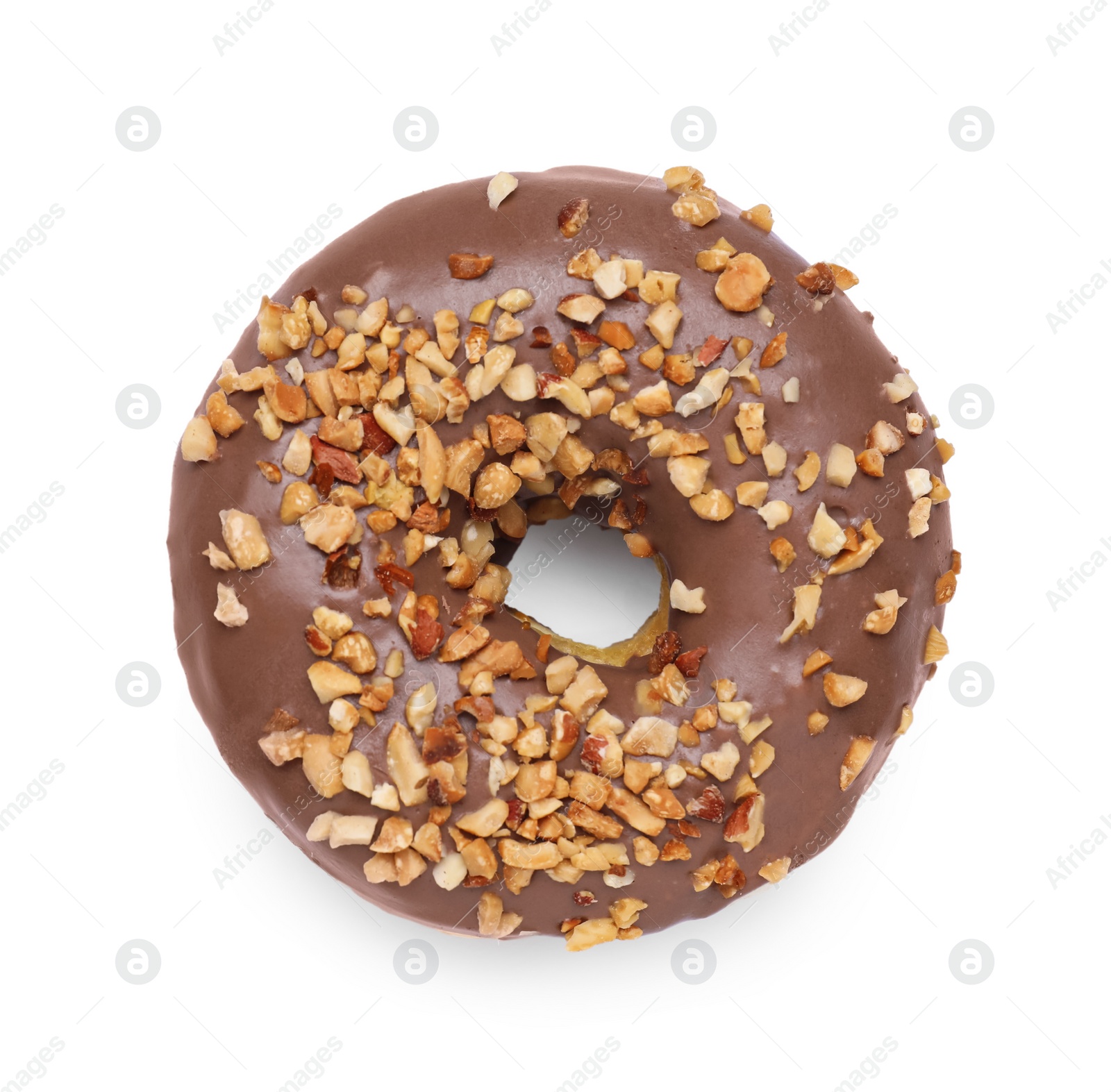 Photo of Tasty glazed donut decorated with nuts isolated on white, top view