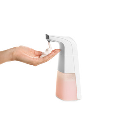 Photo of Woman using automatic soap dispenser on white background, closeup