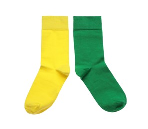 Photo of Different colorful socks on white background, top view