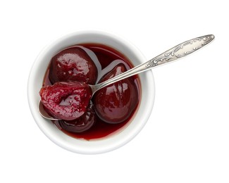 Photo of Bowl of tasty sweet fig jam and spoon isolated on white, top view