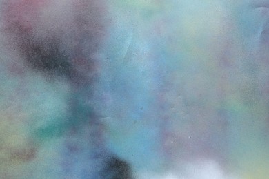 Photo of Texture of abstract spray paint as background, top view