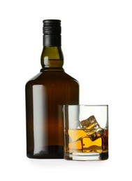 Photo of Whiskey in glass and bottle isolated on white