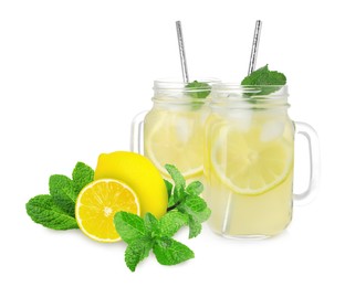 Image of Mason jars with tasty lemonade, fresh ripe fruits and mint on white background