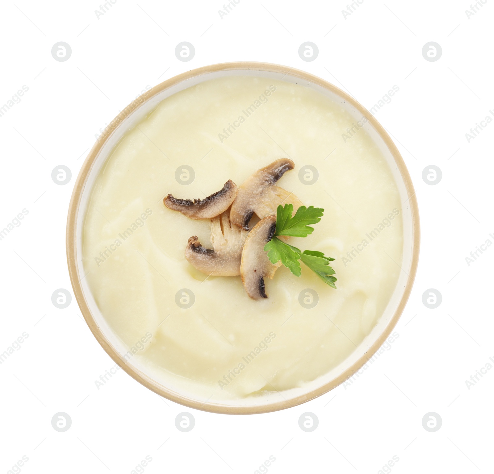 Photo of Bowl of tasty cream soup with mushrooms and parsley isolated on white, top view