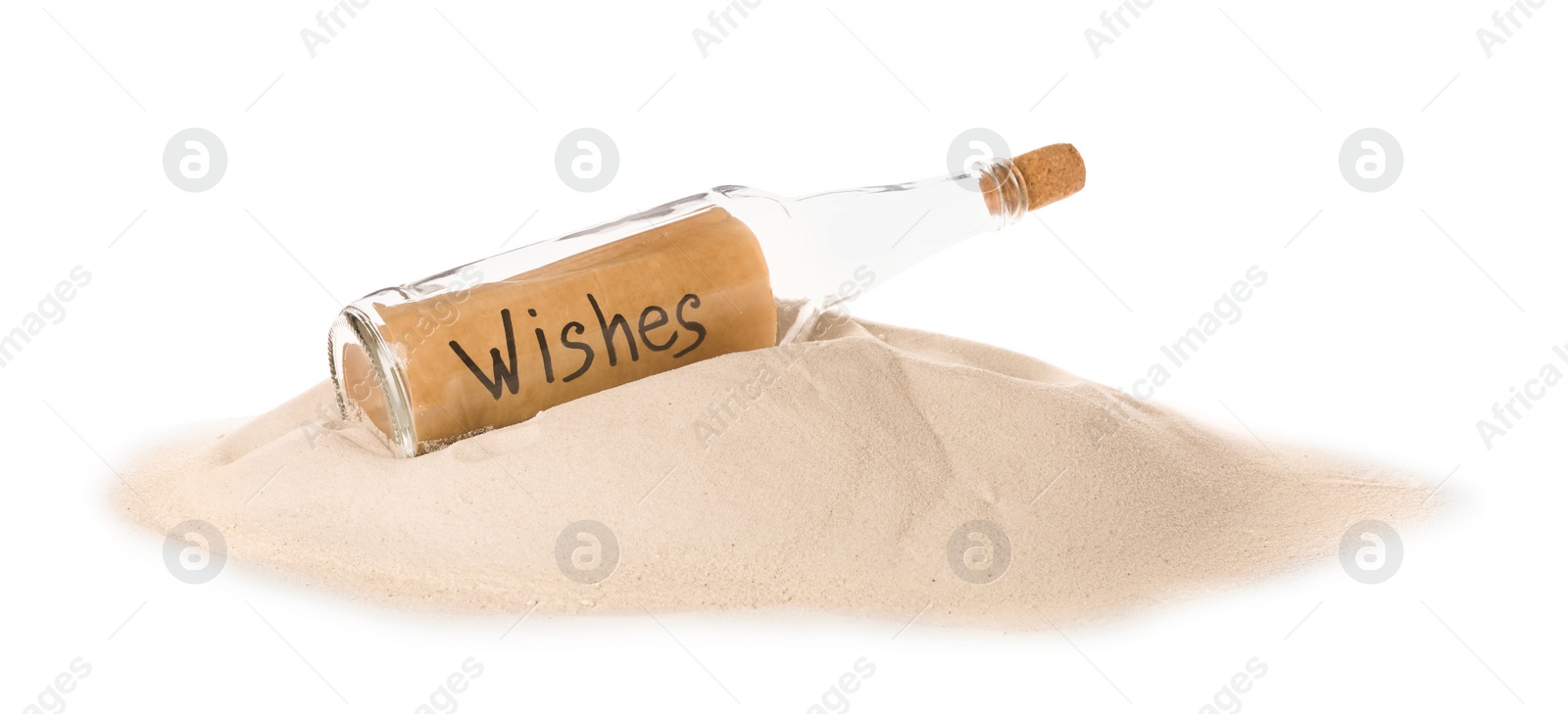 Photo of Corked glass bottle with Wishes note on sand against white background