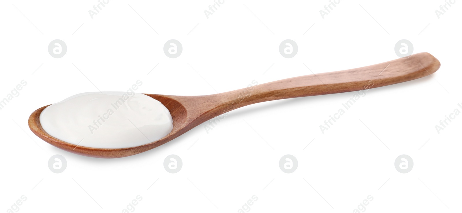 Photo of Wooden spoon with delicious organic yogurt isolated on white