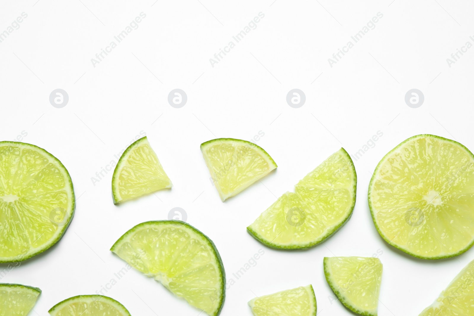 Photo of Juicy fresh lime slices on white background, top view