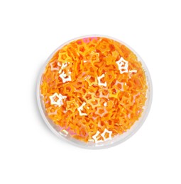 Photo of Orange sequins in shape of stars on white background, top view