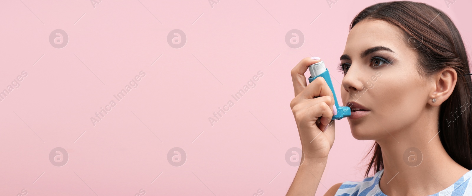 Image of Young woman using asthma inhaler on color background, space for text. Banner design