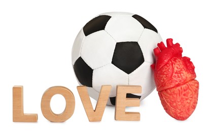 Photo of Soccer ball, heart and word Love on white background