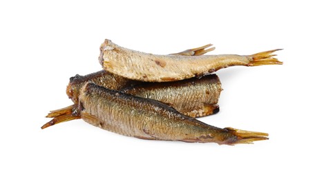 Many tasty smoked sprats isolated on white