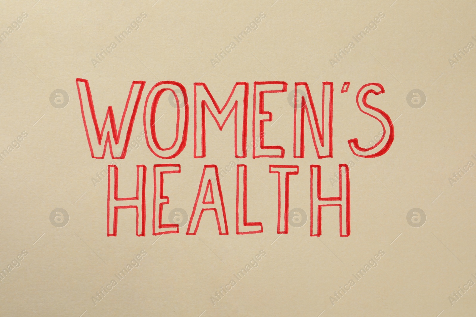 Photo of Words Women's Health written on beige background, top view