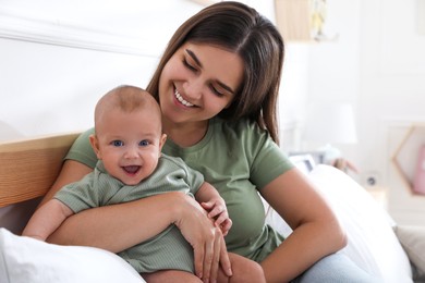 Mother with her cute baby at home