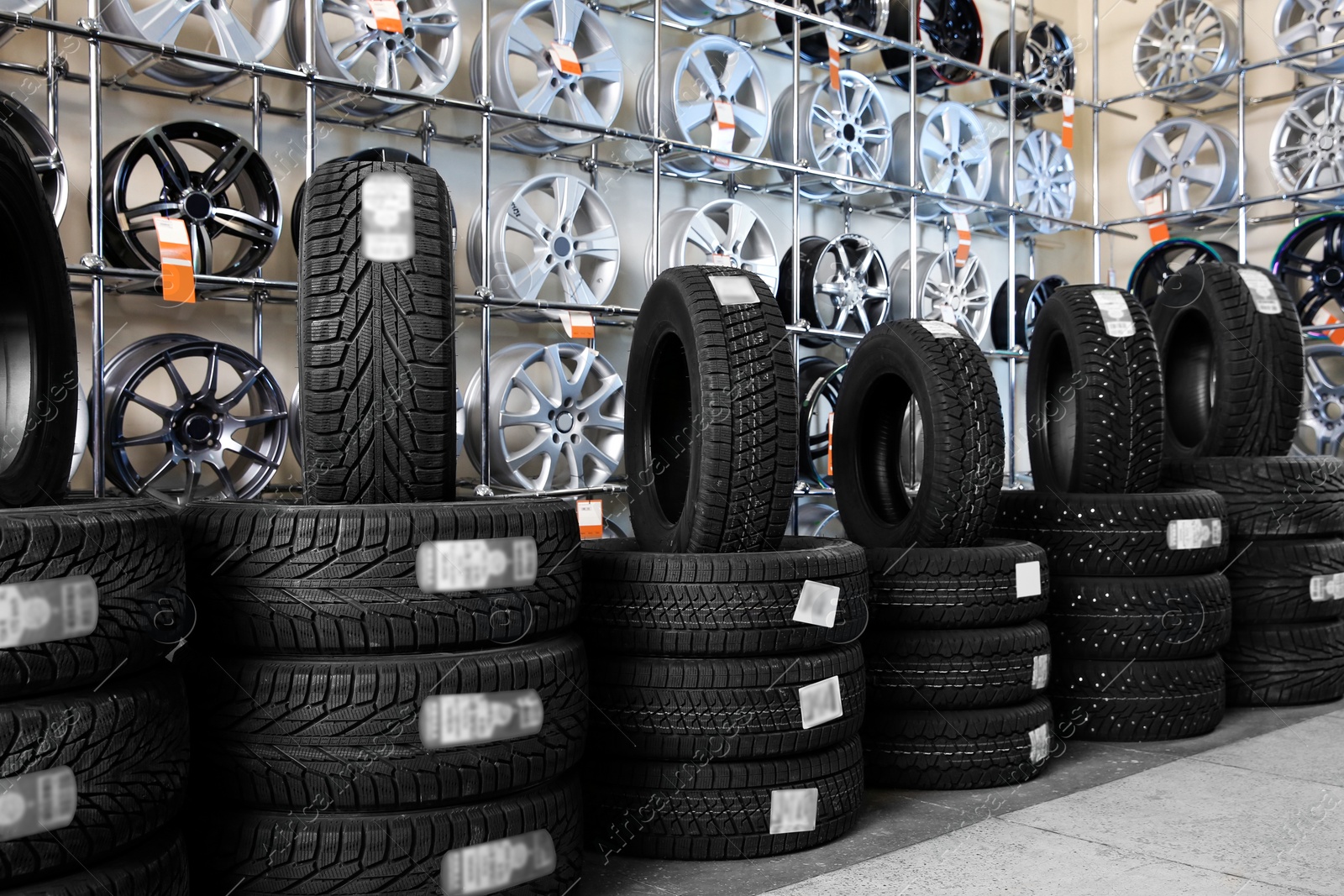 Photo of Car tires and alloy wheels in automobile service center