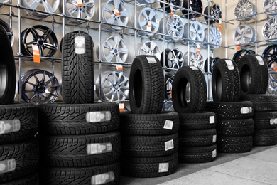 Car tires and alloy wheels in automobile service center