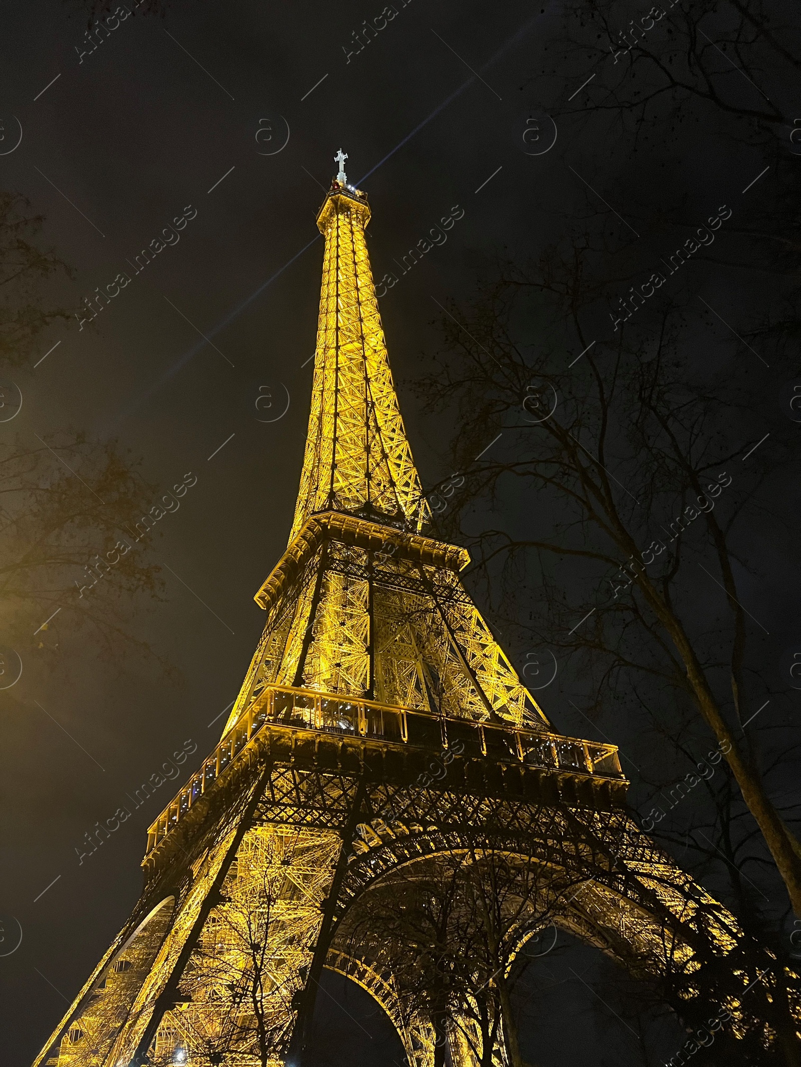 Photo of Beautiful illuminated Eiffel tower against night sky, low angle view