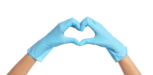 Photo of Doctor in medical gloves showing heart with hands on white background, closeup