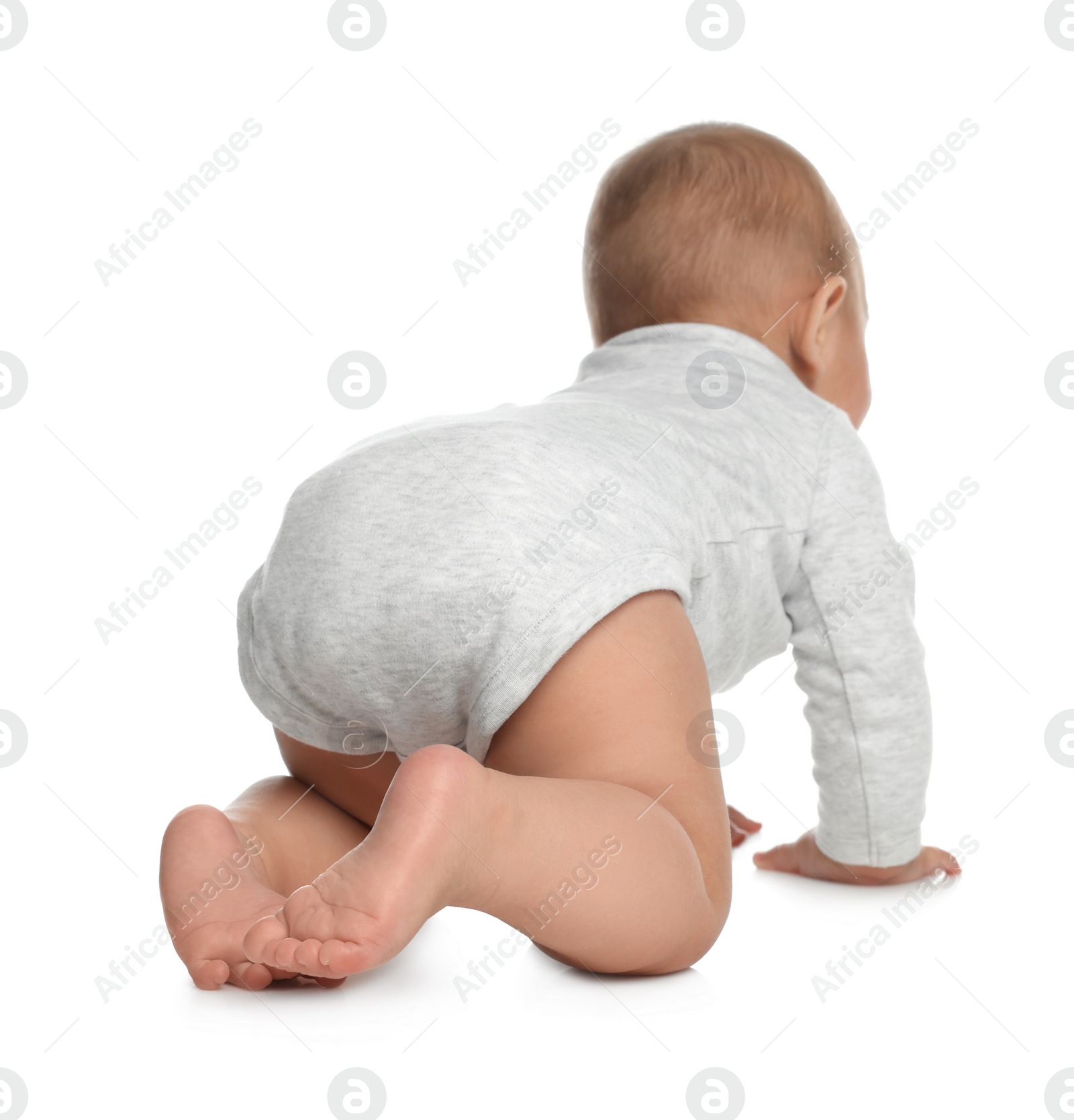 Photo of Cute little baby crawling on white background