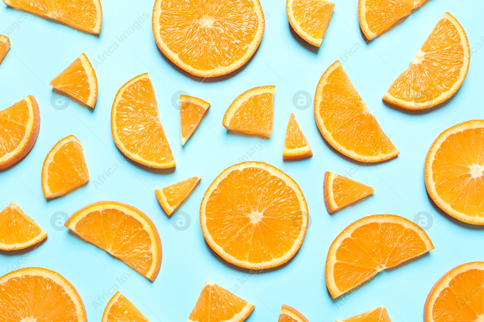 Photo of Flat lay composition with orange slices on color background