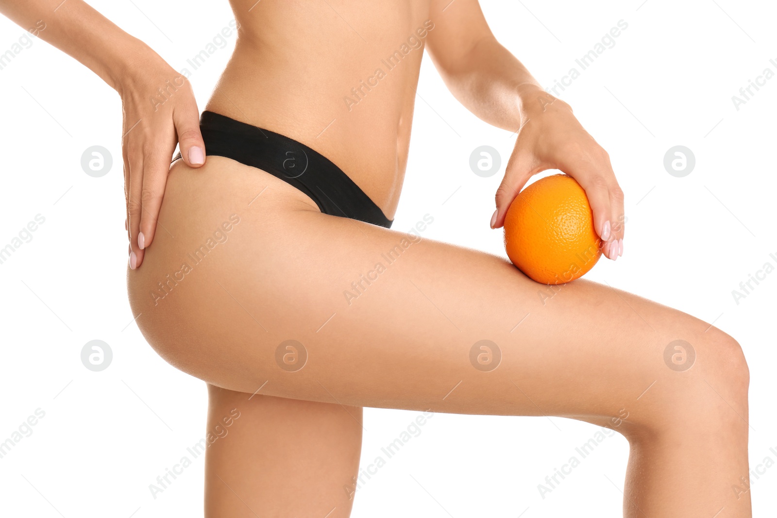 Photo of Closeup view of slim woman in underwear with orange on white background. Cellulite problem concept