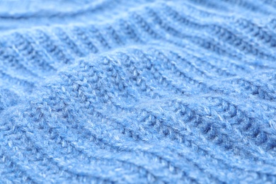 Texture of cozy warm sweater as background, closeup