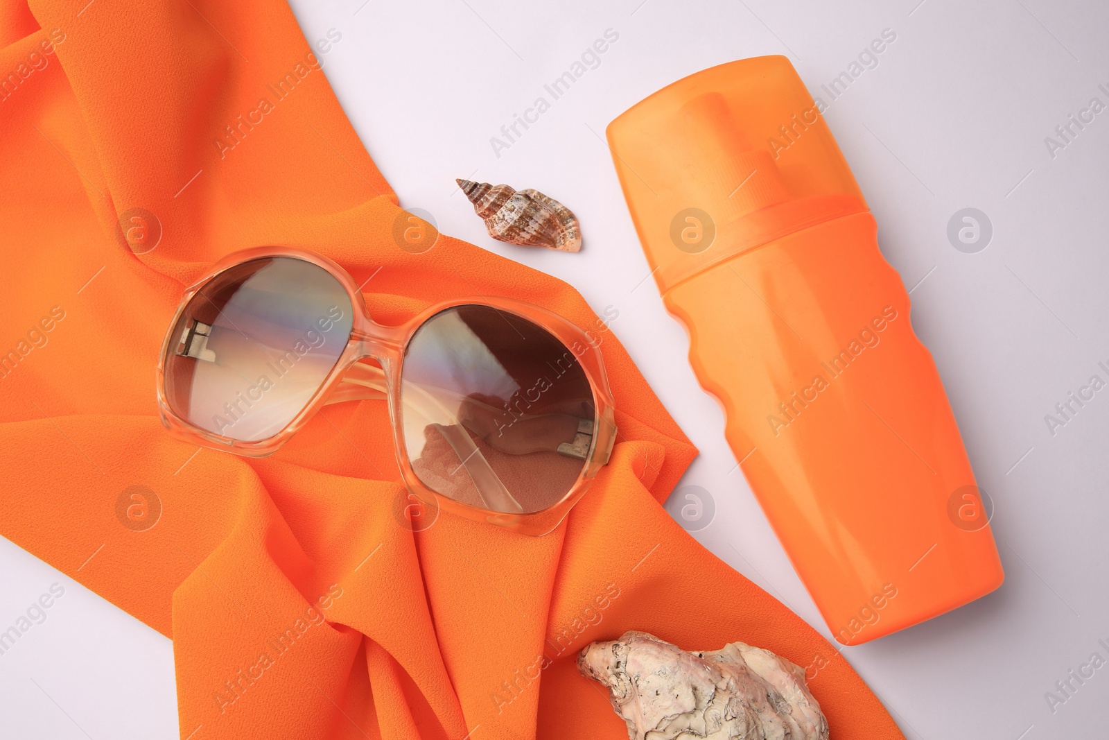 Photo of Flat lay composition with bottle of sunscreen on white background