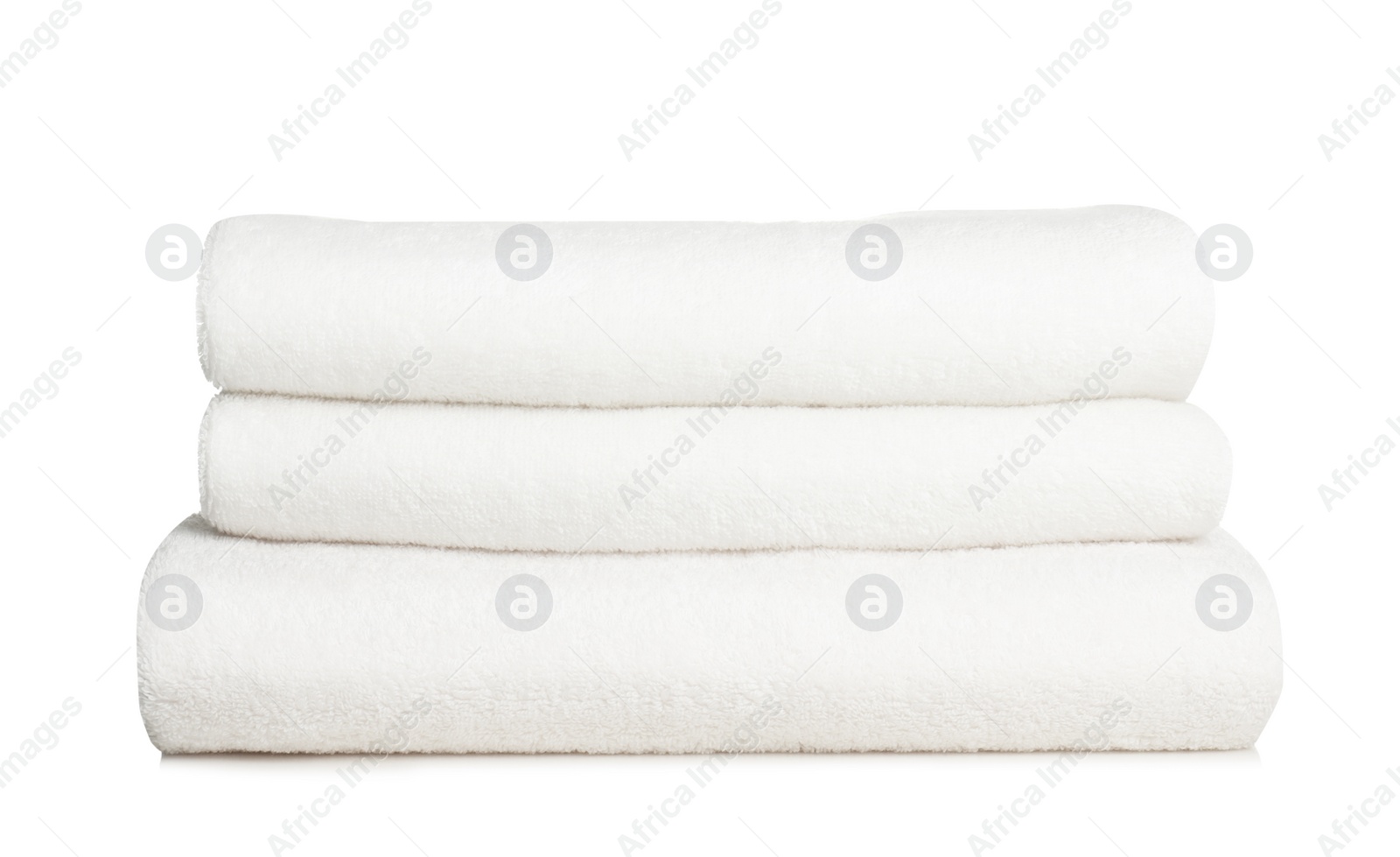 Photo of Folded soft terry towels on white background