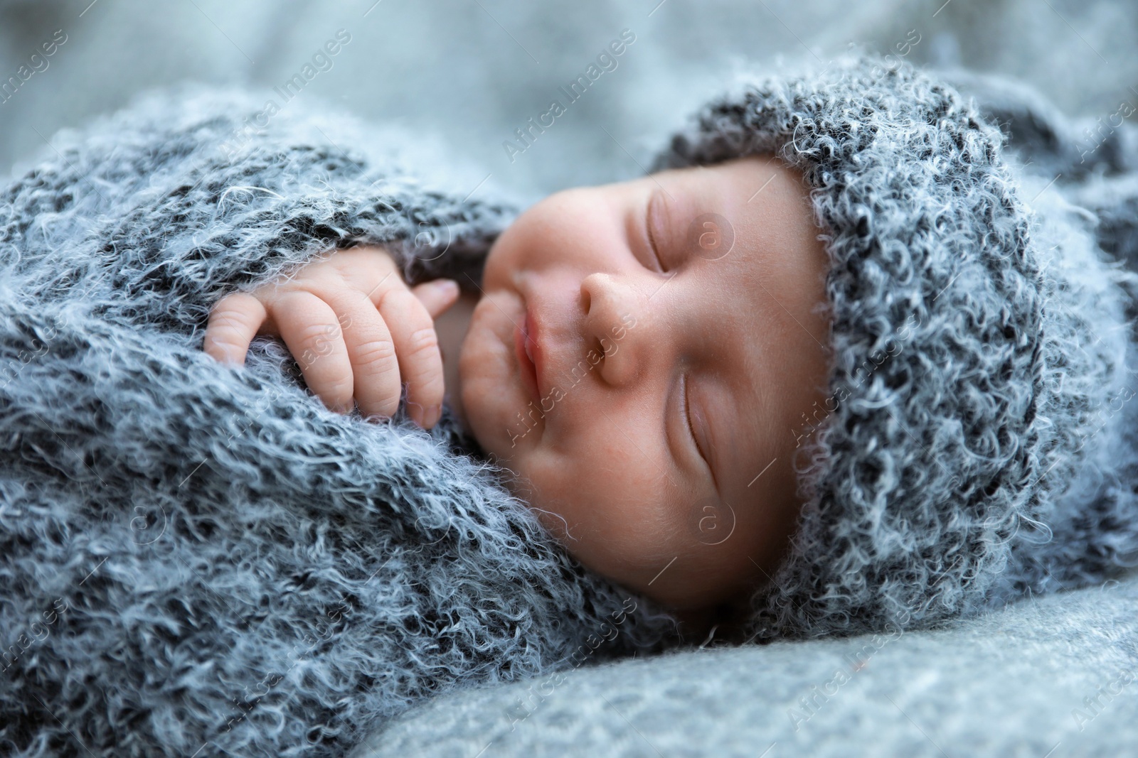 Photo of Cute newborn baby sleeping on blanket, closeup