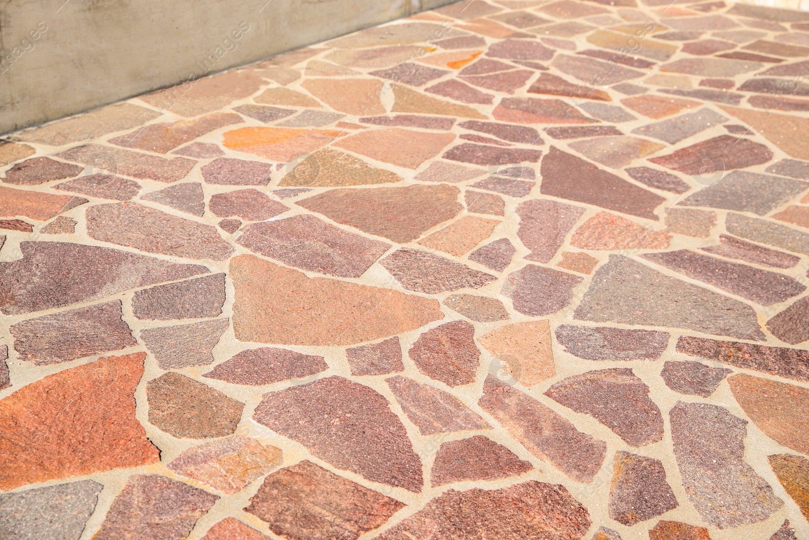 Photo of Beautiful pavement with stone fragments as background