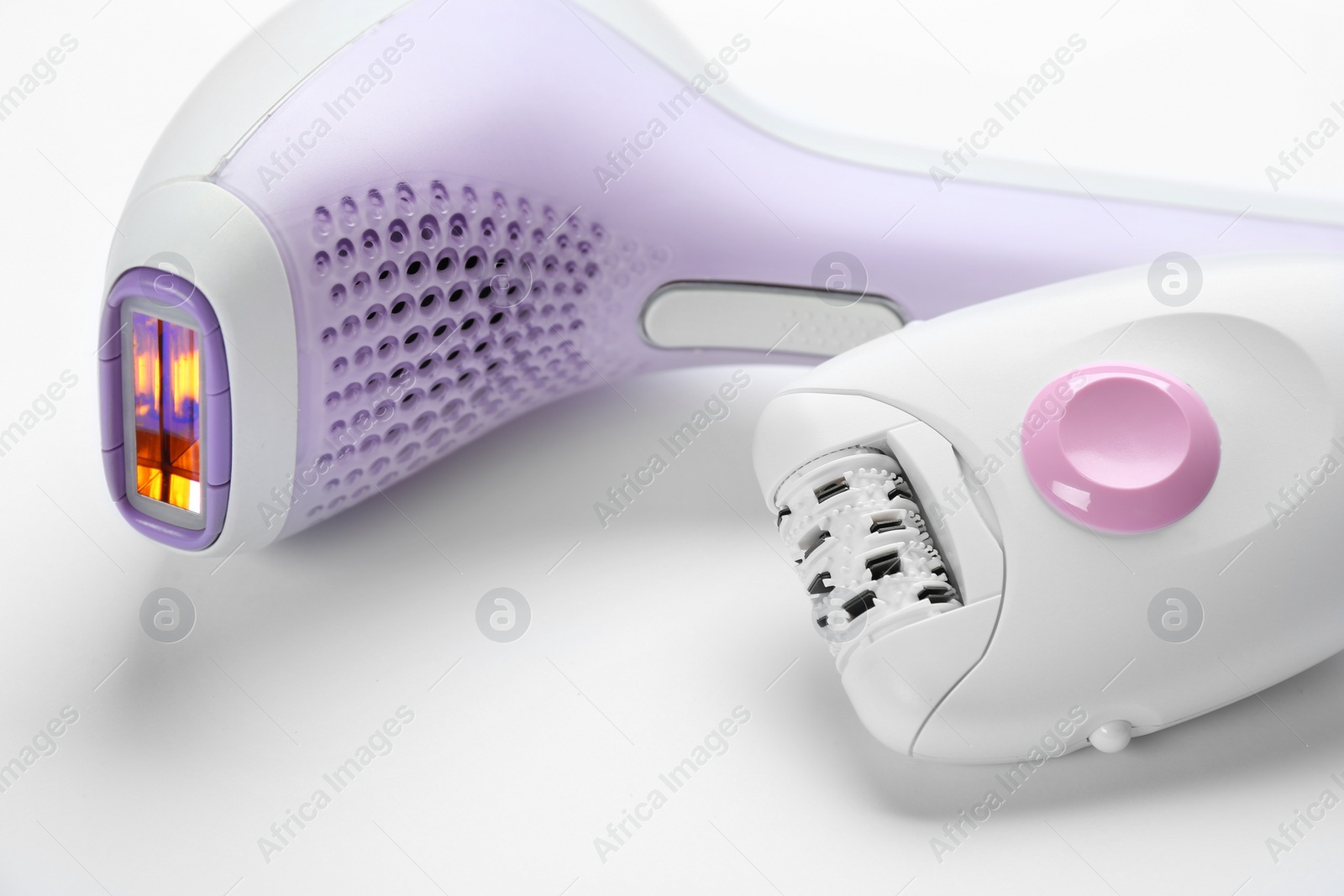 Image of Modern devices for epilation on white background, closeup