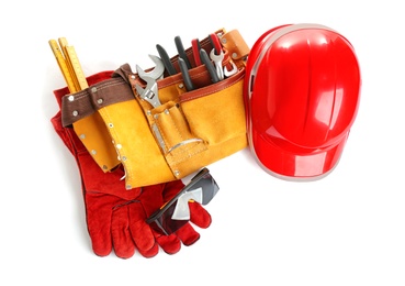 Photo of Composition with construction tools and helmet on white background, top view