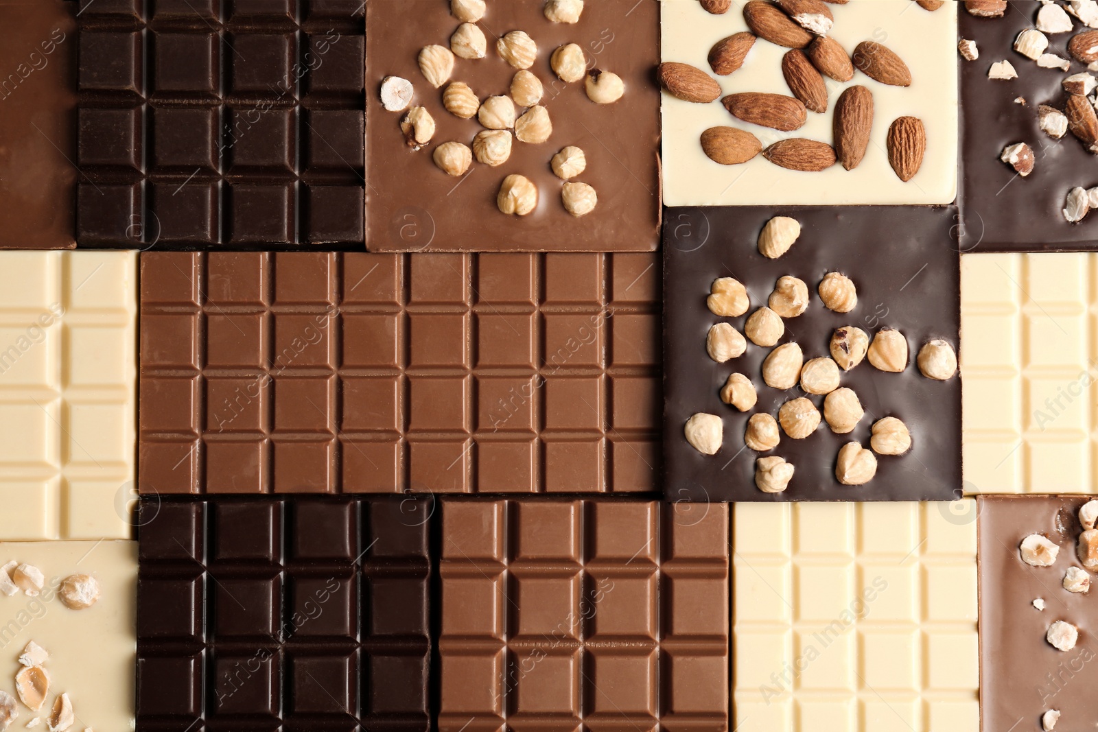 Photo of Many different delicious chocolate bars as background