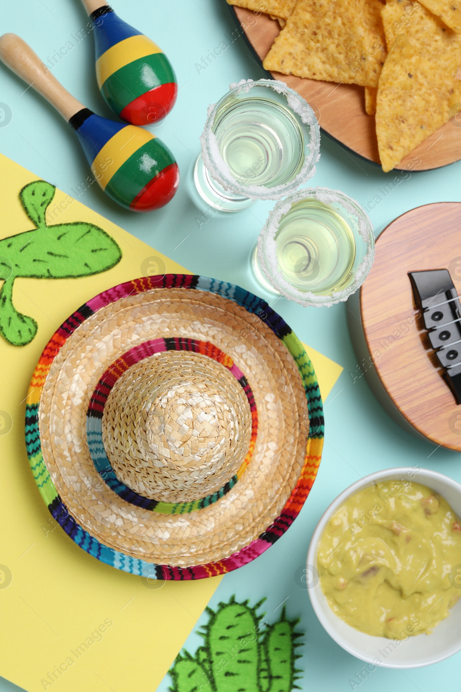 Photo of Flat lay composition with Mexican sombrero hat on color background