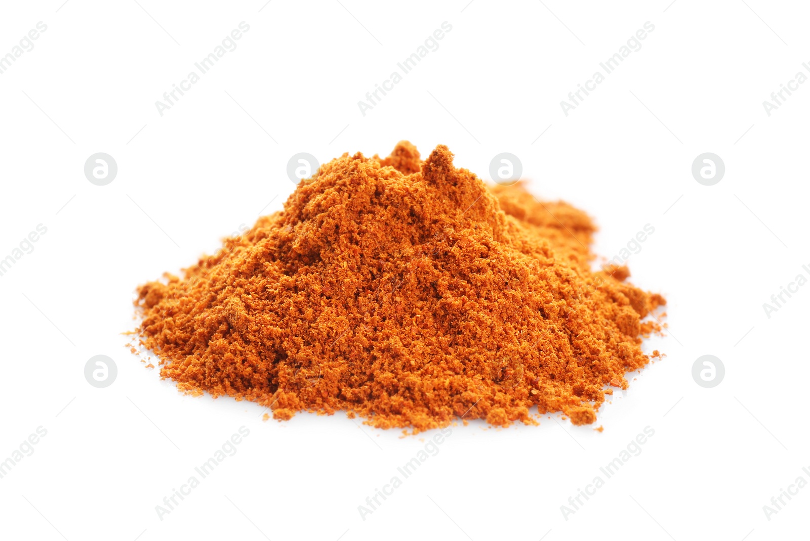 Photo of Heap of red pepper powder on white background