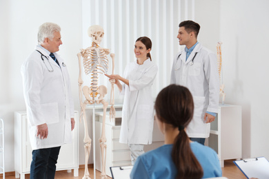 Photo of Medical students having lecture in orthopedics at clinic