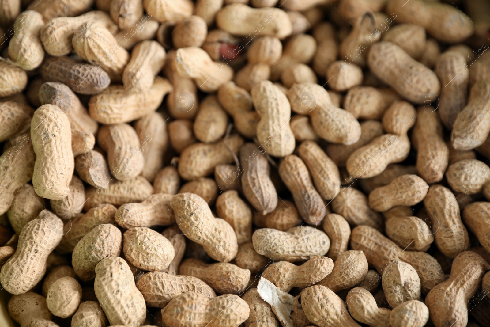 Photo of Heap of delicious peanuts as background, closeup view