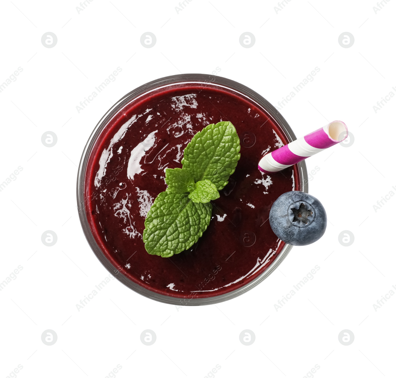 Photo of Glass of tasty blueberry smoothie isolated on white, top view