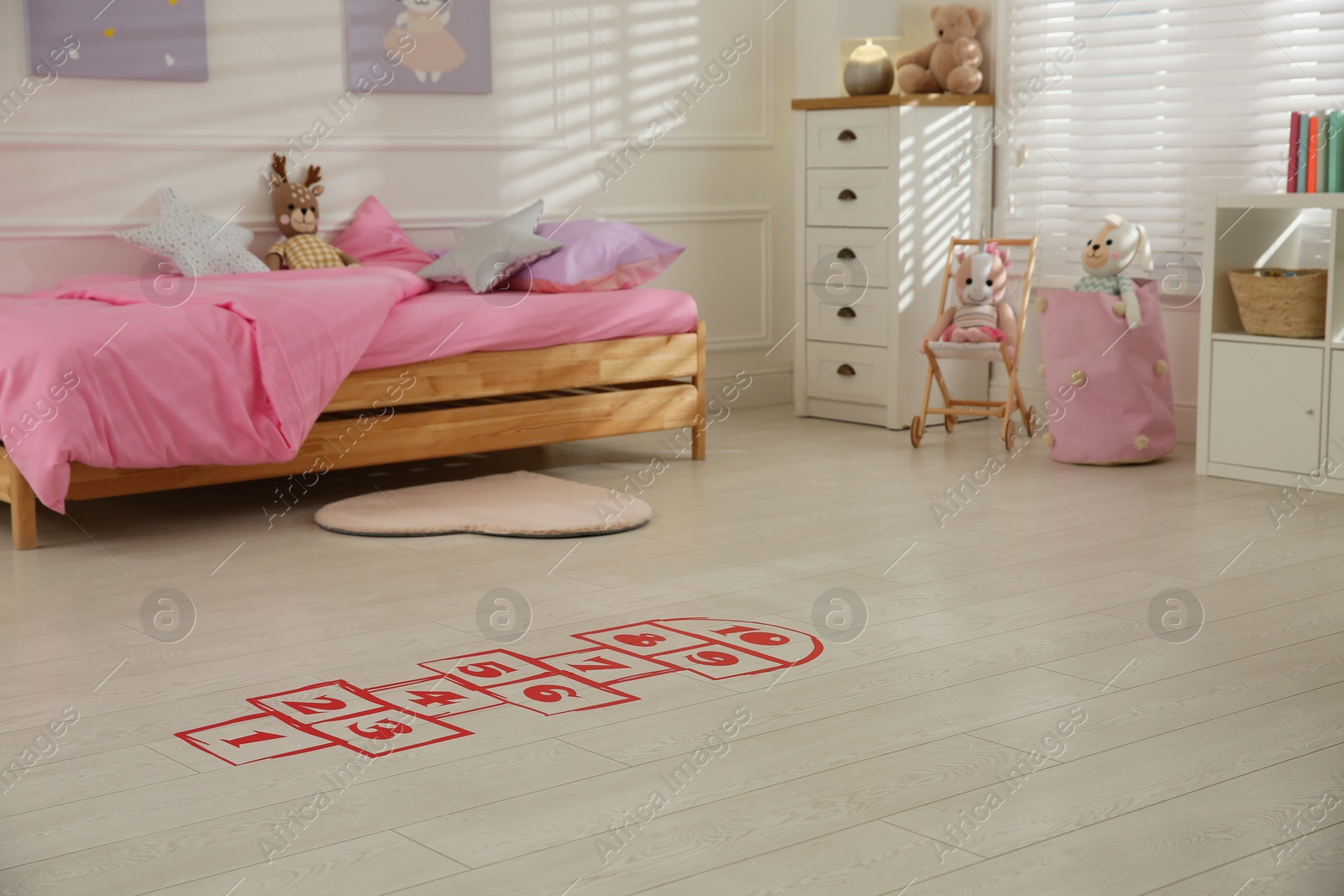 Photo of Red hopscotch floor sticker in bedroom at home