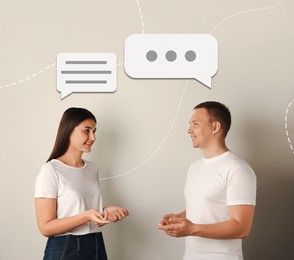 Image of Dialogue. Man and woman with speech bubbles above them on light background