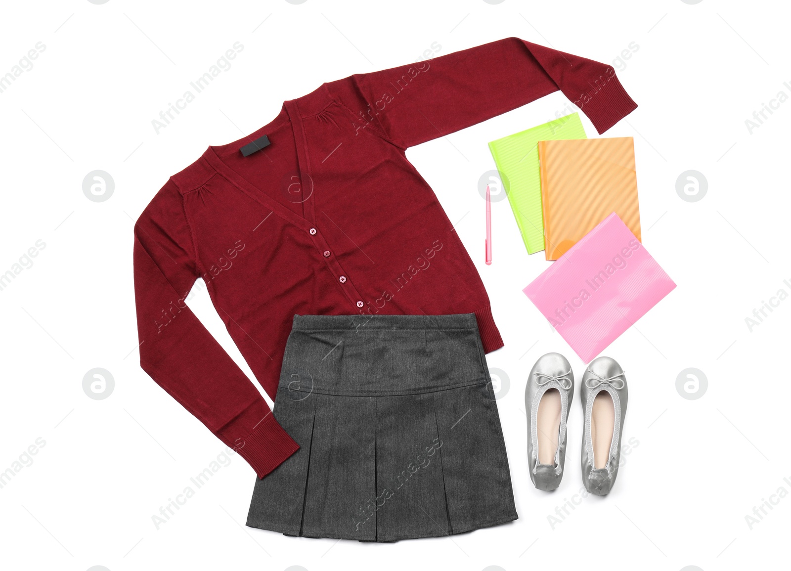 Photo of Stylish school uniform and stationery on white background, top view