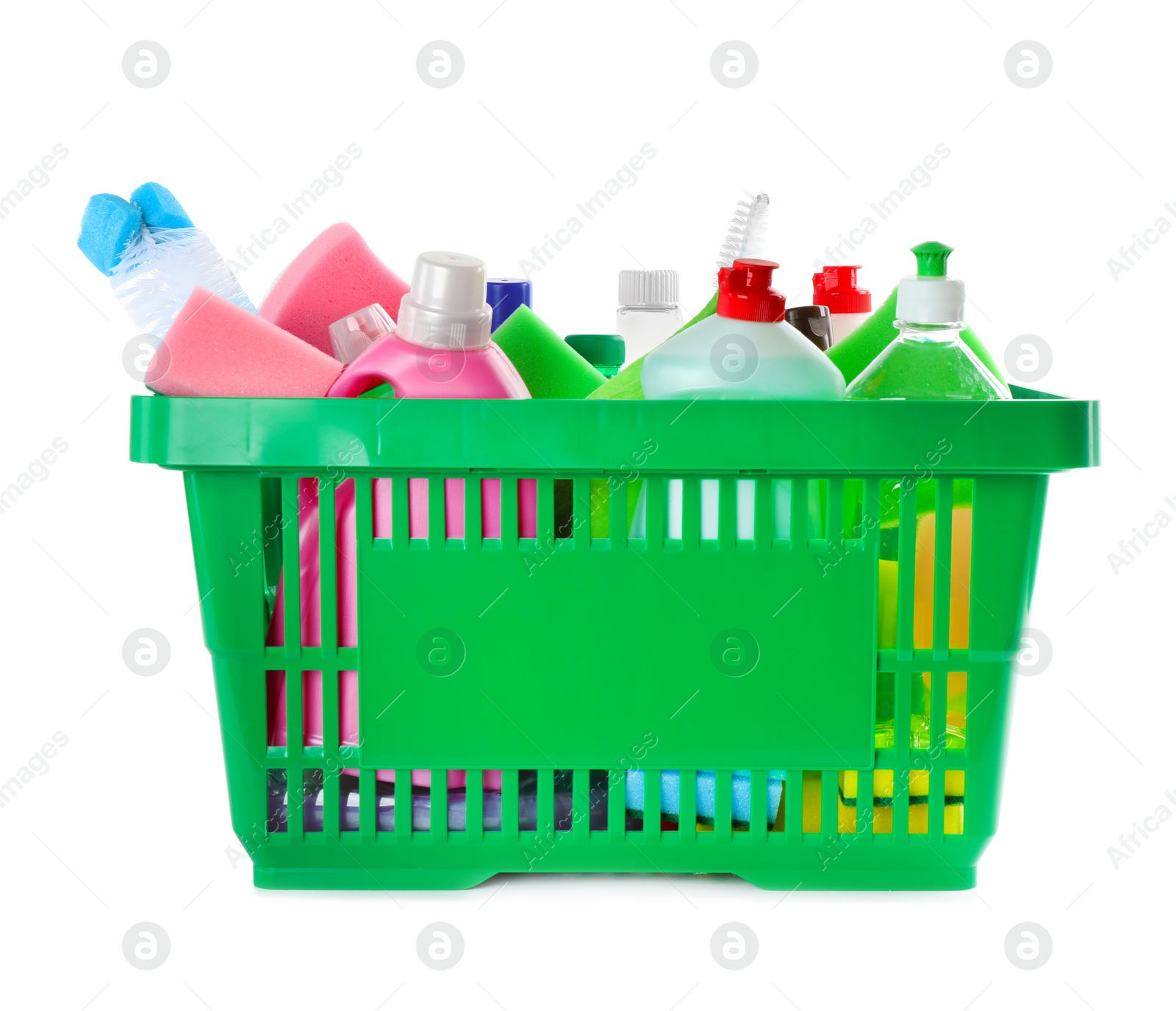 Photo of Green shopping basket with different household chemicals on white background