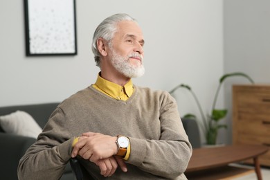 Photo of Portrait of handsome senior man at home